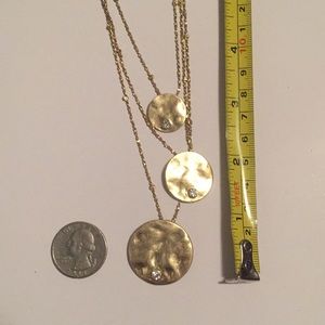 Gold colored necklace